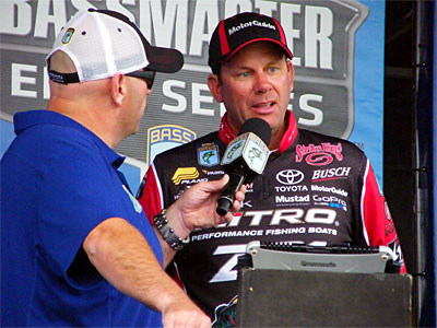 Professional angler Kevin VanDam talks to emcee Dave Mercer on stage at the August 28, 2015 Lake St. Clair Bassmaster Elite Series bass tournament.